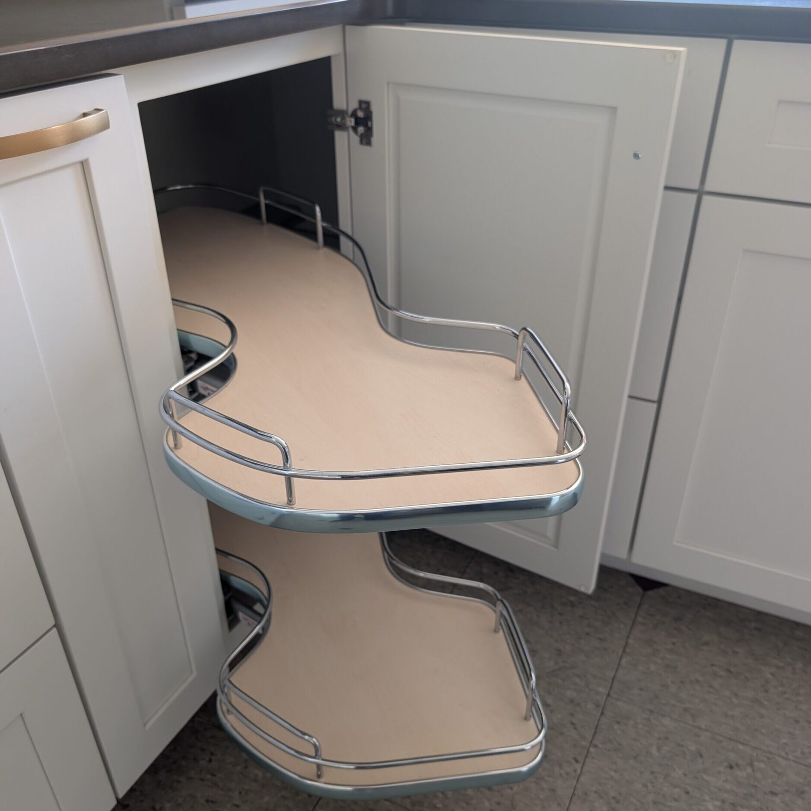 Make the most of your corner cabinets with our Pull-Out Corner Shelf. This innovative design maximizes access to the most difficult-to-reach spaces. The two-tier pull-out design allows you to store pots, pans, or other kitchen essentials in an organized manner, making them easy to reach when you need them. Built with sturdy metal rails and wooden shelves, this unit ensures long-lasting durability while maintaining a sleek and modern aesthetic in your kitchen.